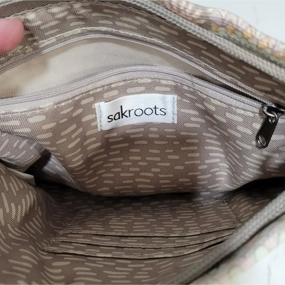 Sakroots Crossbody Adjustable Strap Pockets inside.